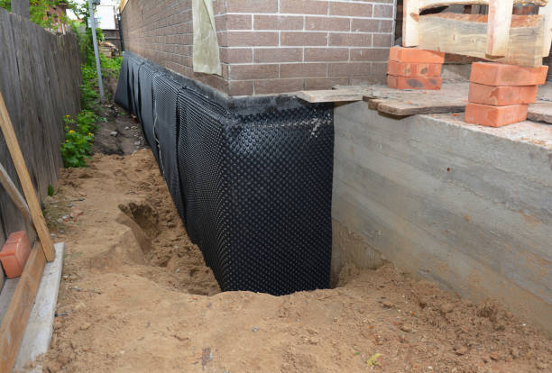 SJ Waterproofing Pros technician performing targeted Emergency Waterproofing assessment in Aurora, NY